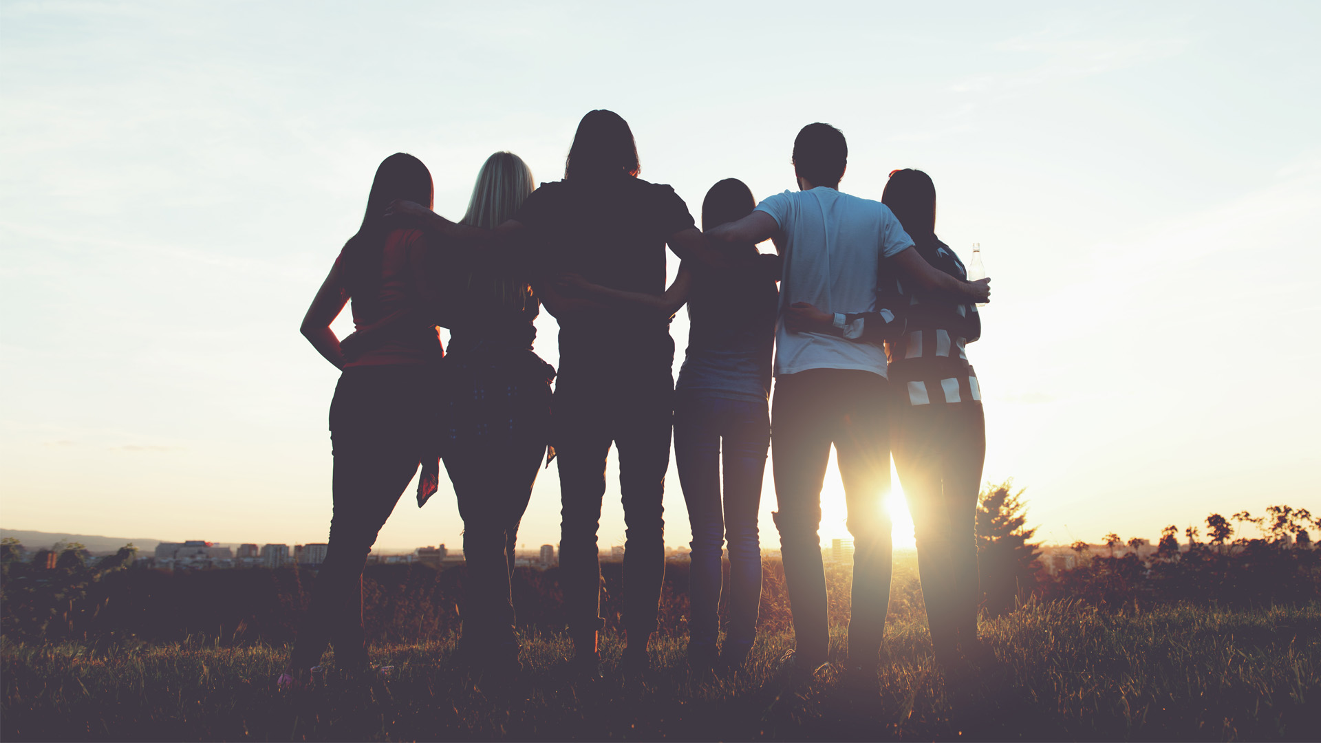 Group of people watching the sun set