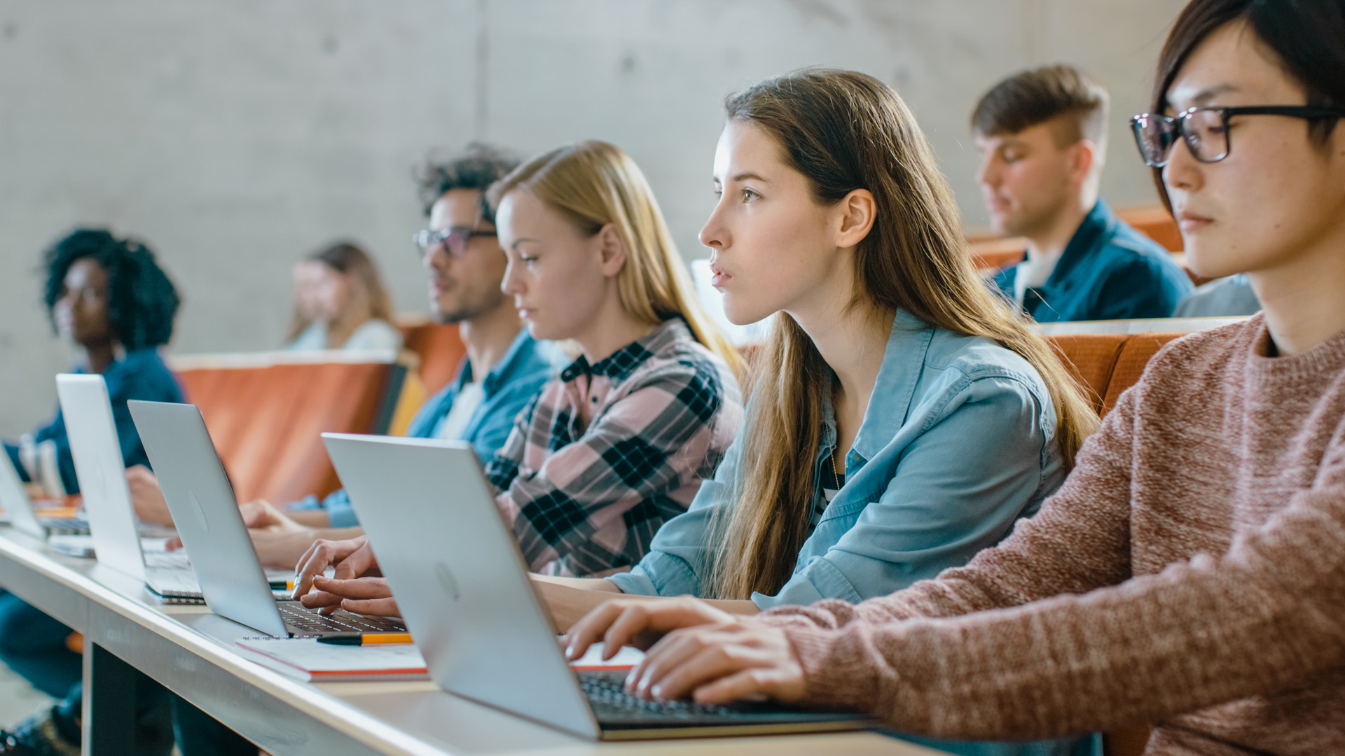 classroom full of students on laptops