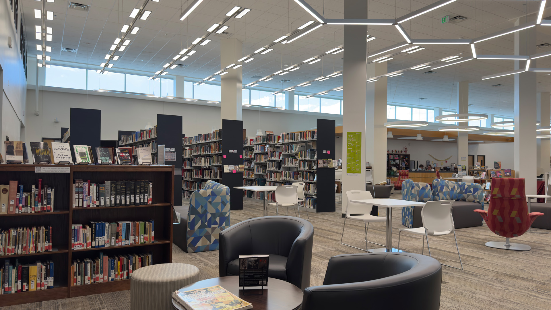 tables, chairs and bookshelves in the library