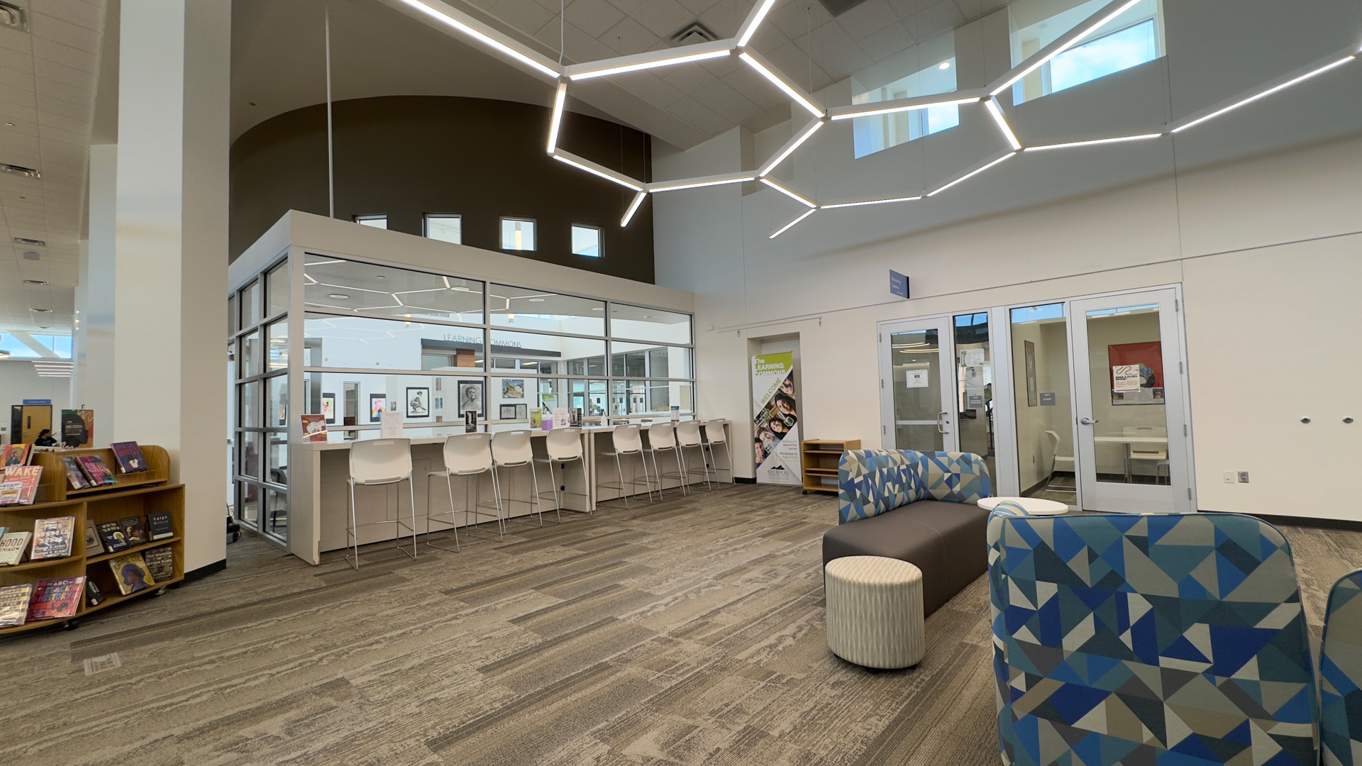 tables, chairs and bookshelves in the library