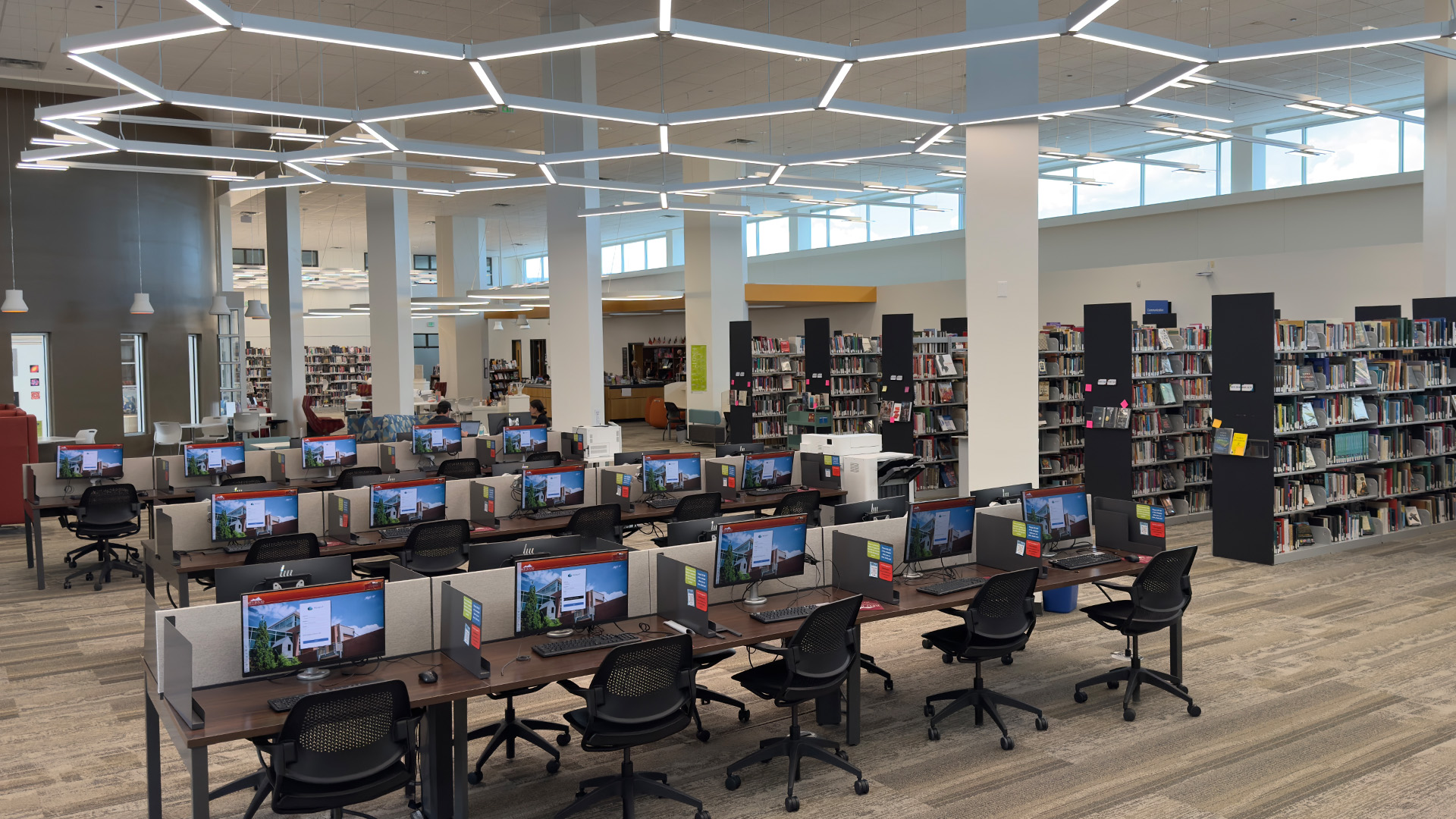 computers, tables and bookshelves