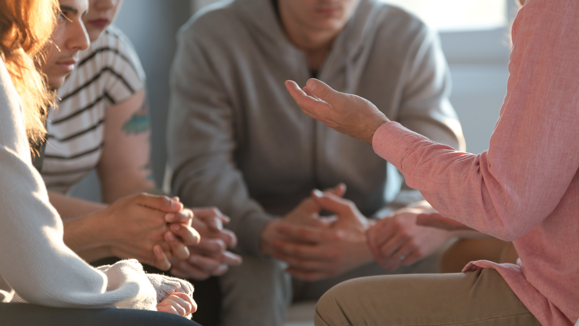 students sitting in a circle talking