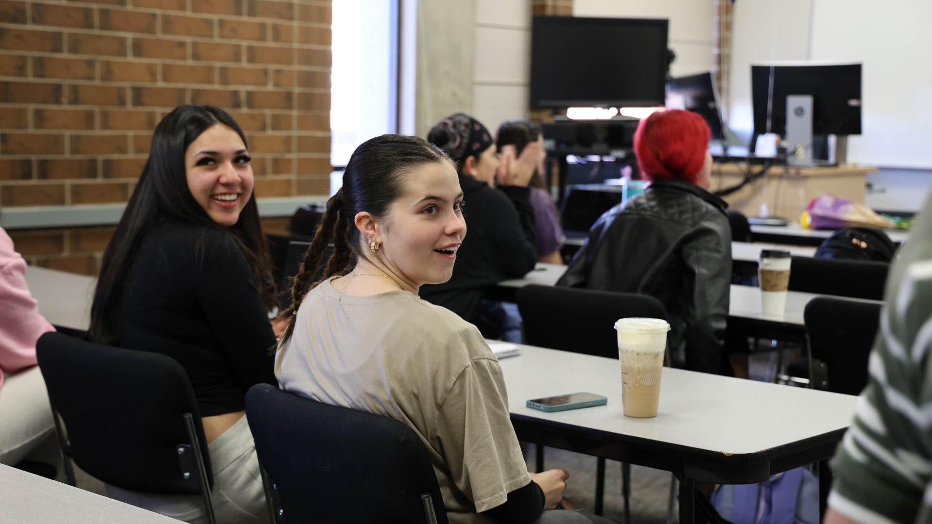 Students talking in a classroom