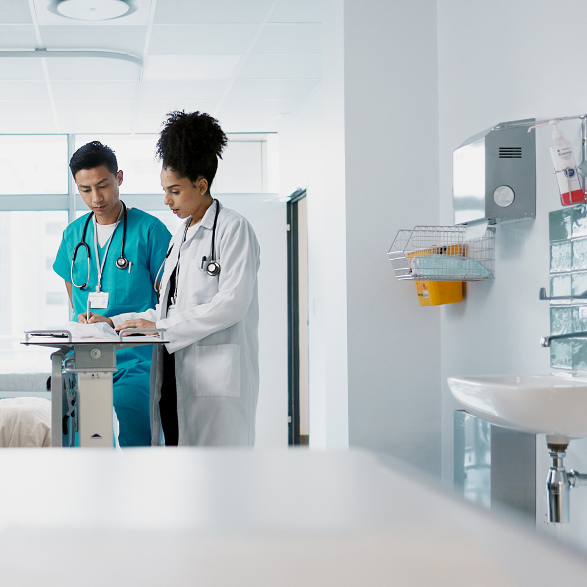 Doctor, team and nurse in discussion on tablet