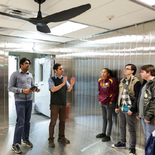 Paulo Cesar Tabares-Velasco, assistant professor of mechanical engineering at Mines talks to students in his Advanced Multiscale Building Energy Research (AMBER) lab. 