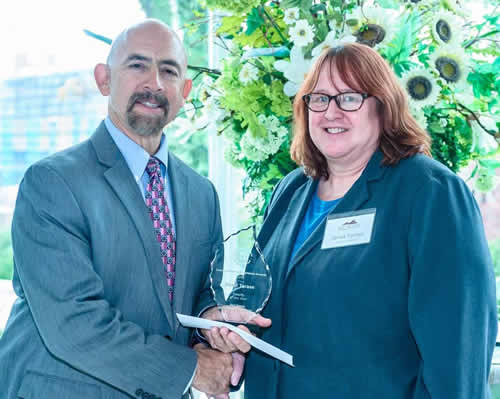 Janet Tarase Accepts Award from Chancellor Joe Garcia