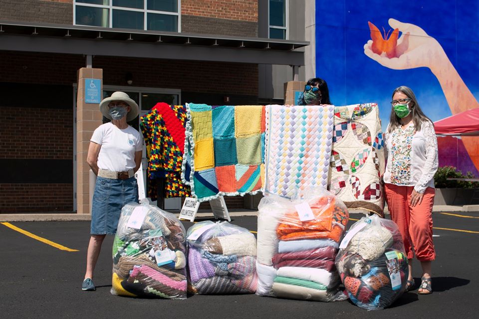 Knitting4Peace Partners Deliver Handmade Blankets to RRCC Students