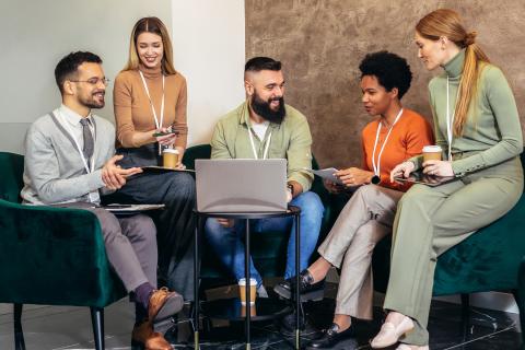 group of people in chairs talking