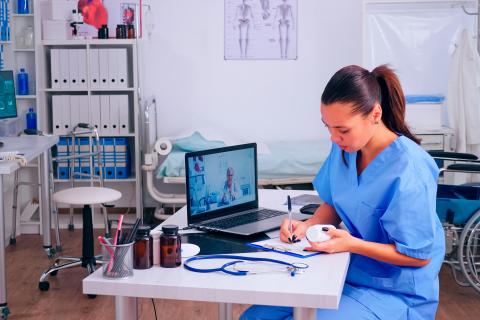 PA taking notes listening advice of remote doctor during video call, virtual health conference, training webinar concept