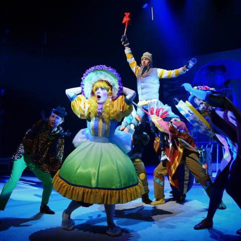 A young actor stands in the costume of a fairy-tale hero