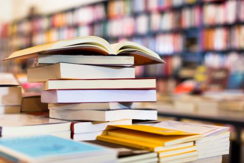 stack of books in a library