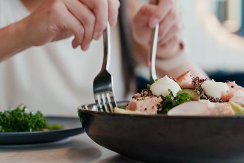 woman eating salad