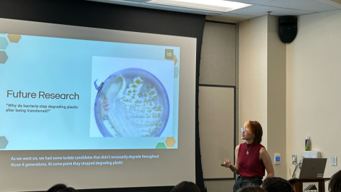 Student Emma Vencer gives a research presentation