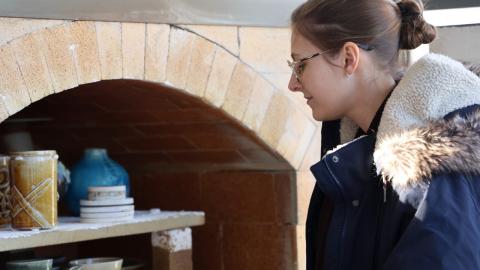 Red Rocks Community College student unloads art the new kiln after the first firing.