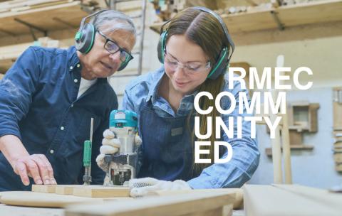 instructor and student building with wood. RMEC Community written on top.