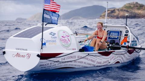 Taryn Smith on her rowing boat in the ocean.