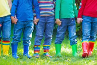 Kids in rain boots. Rubber boots for children