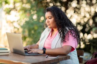 Student using a laptop outside