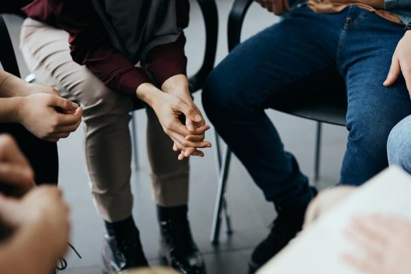 people gather in a group talking