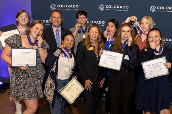 Outstanding Achievement students with their medals and Landon Pirius