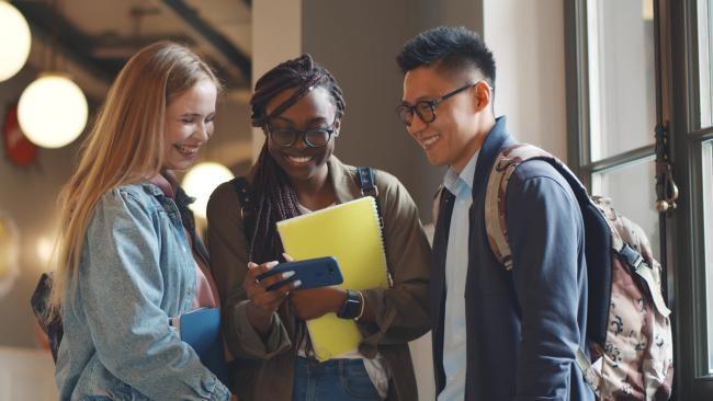 Students looking at phone