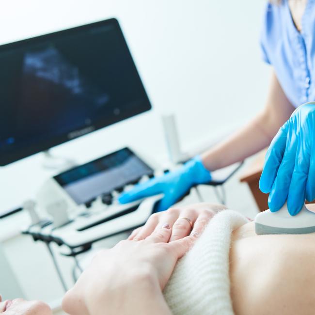 Medical ultrasound imaging and scan. Examining stomach of female patient