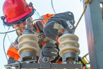 Working electrician working with electrical equipment