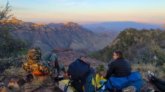 Students enjoying the sunrise on an adventure trip