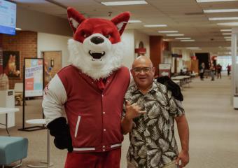 Melvin posing next to the RRCC Fox mascot.