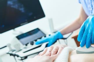 Medical ultrasound imaging and scan. Examining stomach of female patient