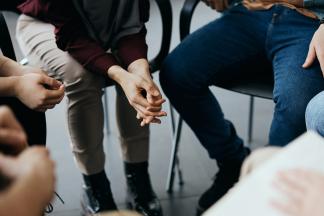 people gather in a group talking