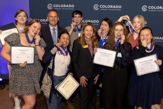Outstanding Achievement students with their medals and Landon Pirius
