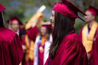 Graduates in red caps and gowns